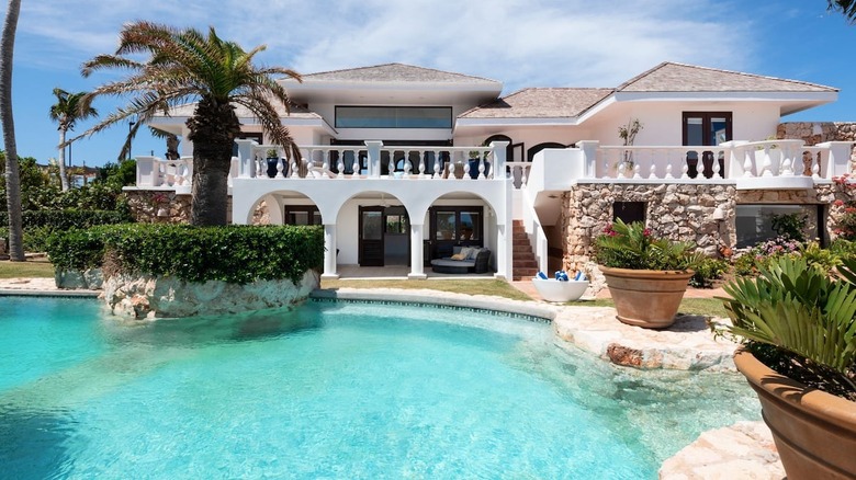 white mansion with pool