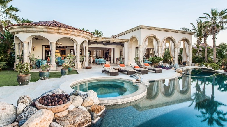 luxurious mansion's pool and cabanas 