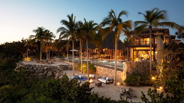 tropical Mexican mansion lit up