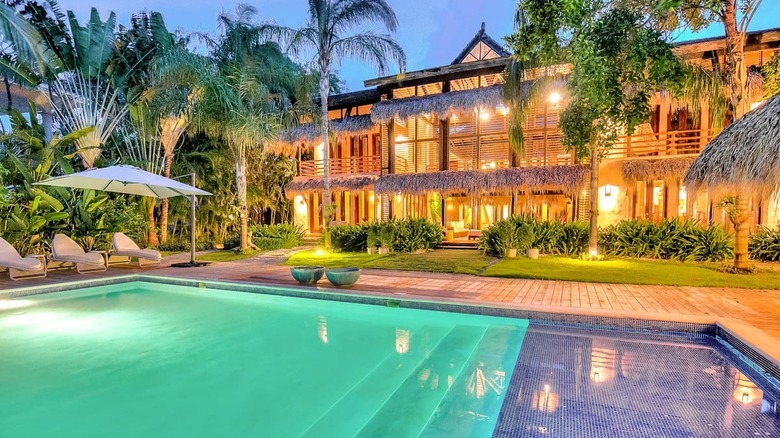 tropical mansion lit up