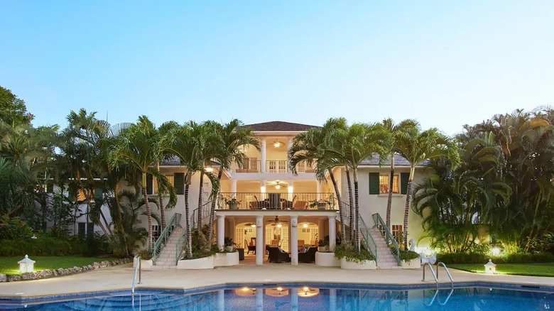 mansion with palms and pool