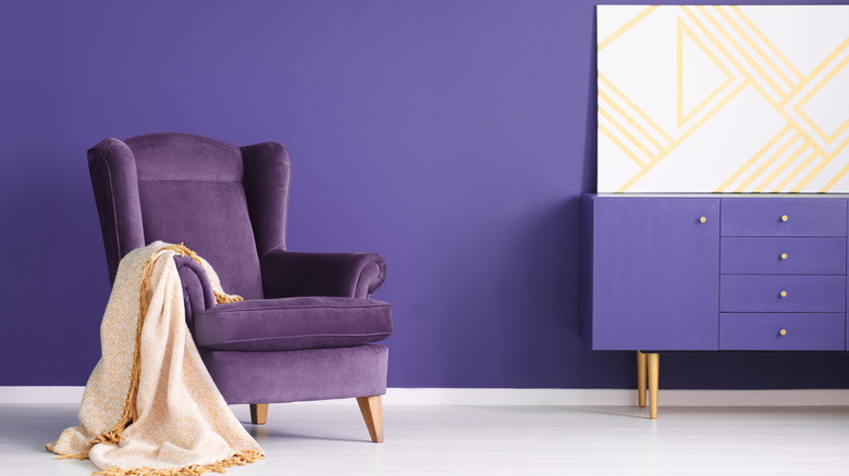 purple living room with geometric painting