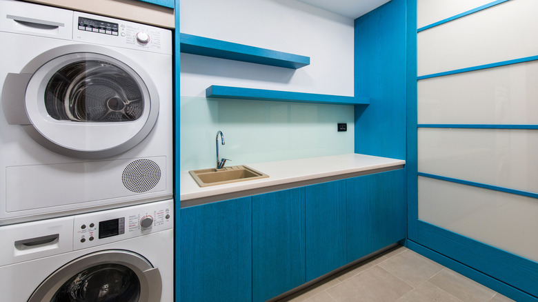 Blue shelves laundry room