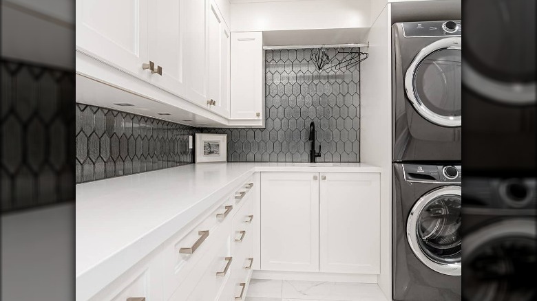 Gray laundry room honeycomb backsplash 