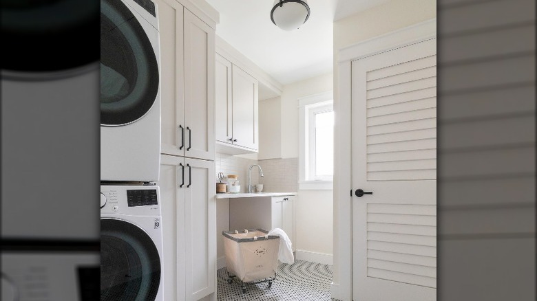 Milky white cabinets laundry room