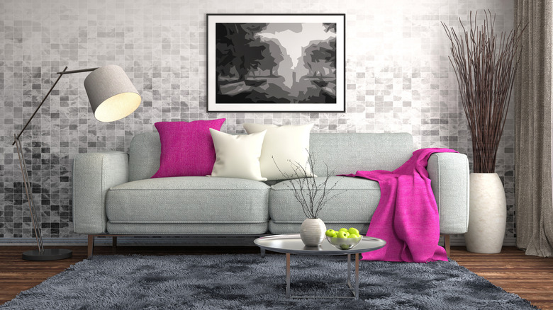 fuchsia pillow on gray couch