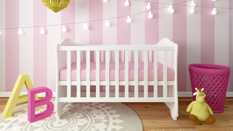 fuchsia decorations around white crib