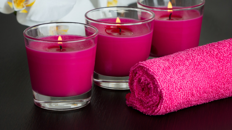 fuchsia candles and towel