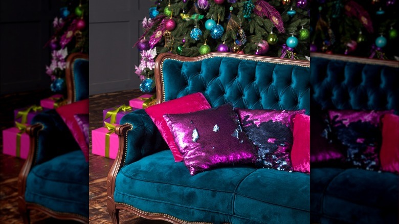 fuchsia pillows on blue couch