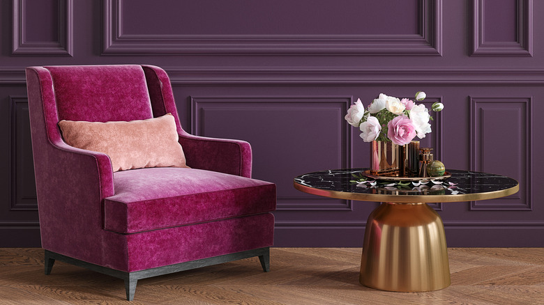 fuchsia chair with gold table