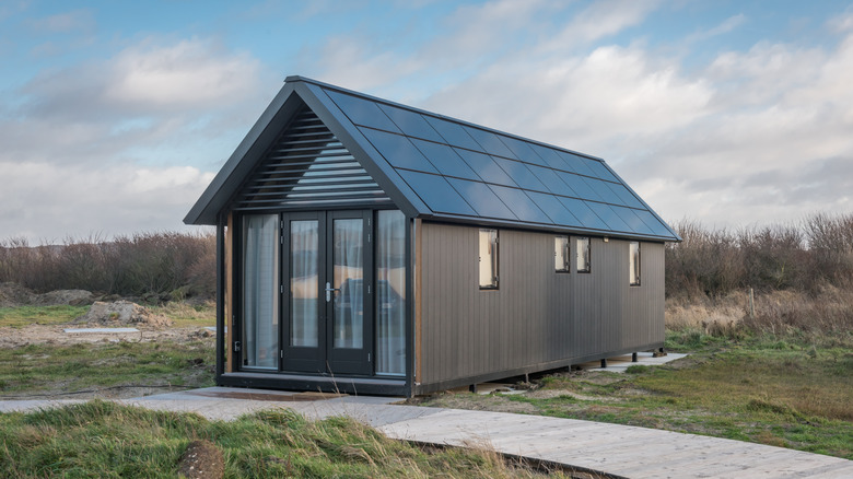 grey cabin on grass