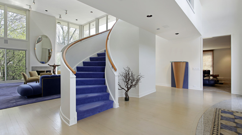 Home with purple carpeted stairs