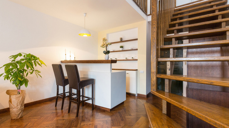 Living room with wooden stairs