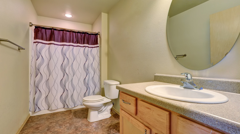 bathroom with fun shower curtain