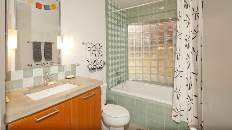 Bathroom with green tile 