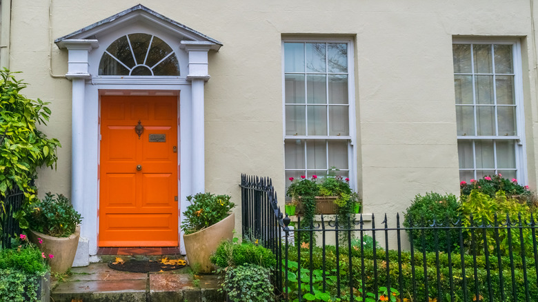 neutral home with orange door 