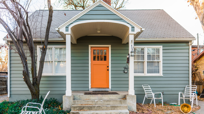 green home with orange door 