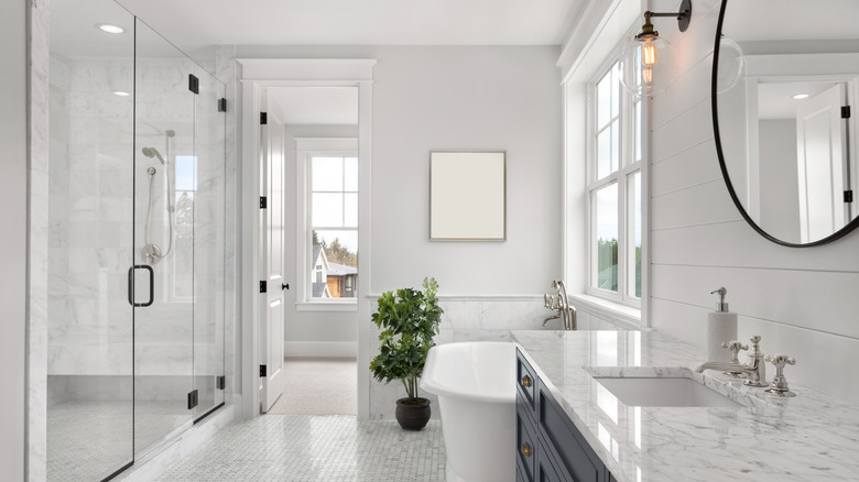 all white and marble bathroom 