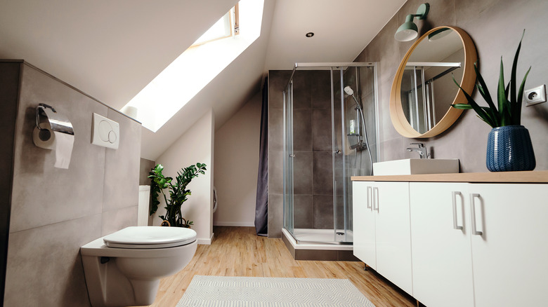 Scandinavian-style bathroom with skylight