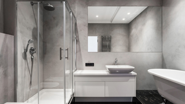 grey bathroom with silver finishes