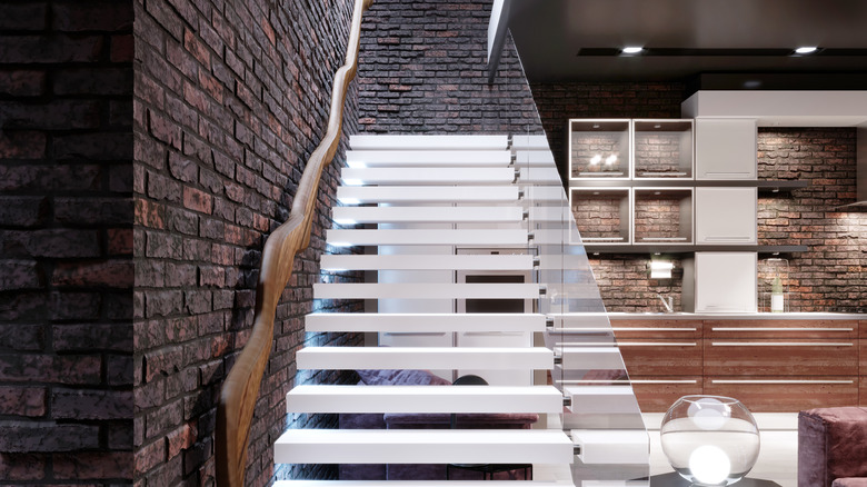 modern staircase with glass railing 