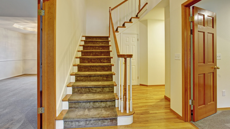 hardwood floor entrance with stairs