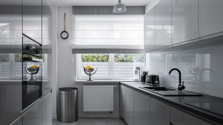 Gray and white window blind