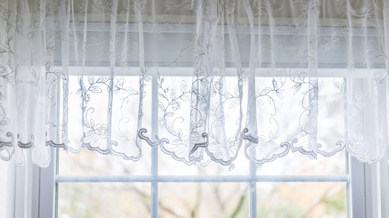 Window with white lace valance