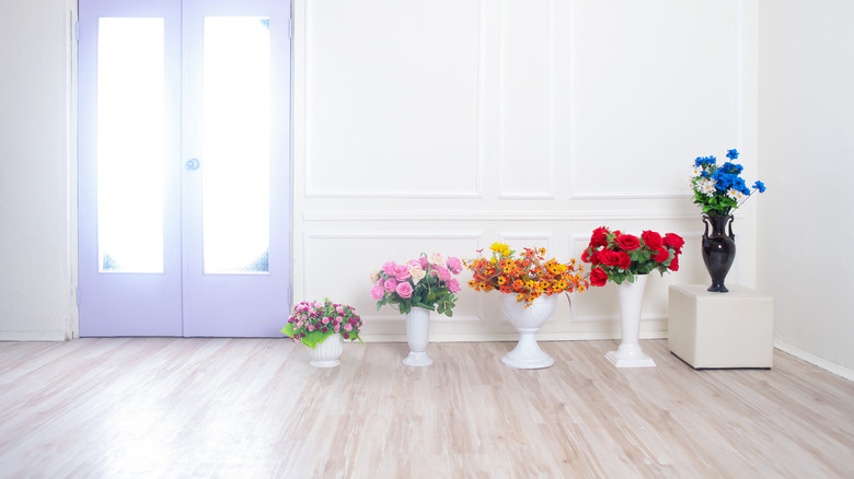 room with purple door and flowers