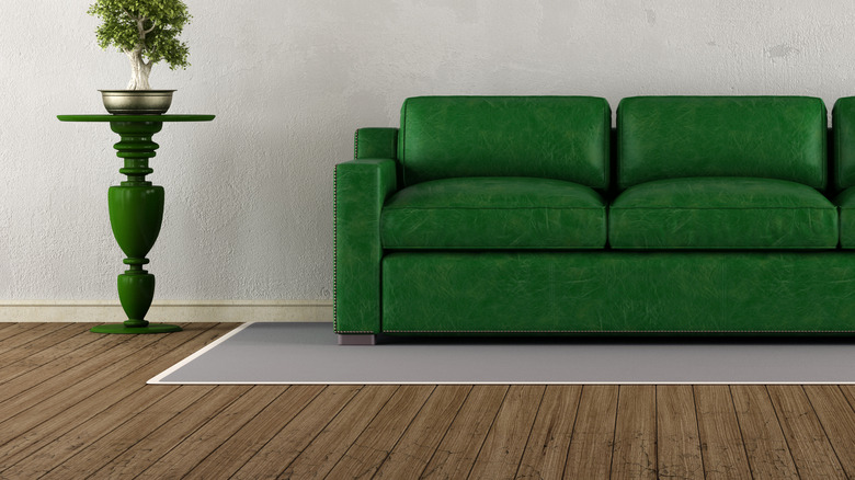 living room with green furniture