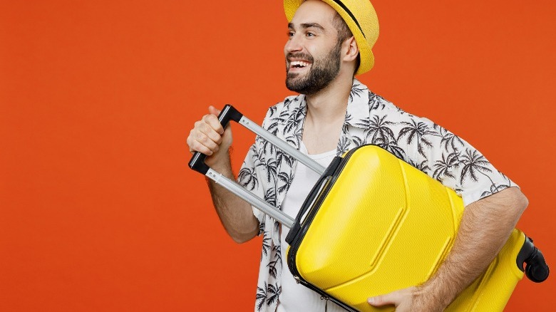 Man holding suitcase