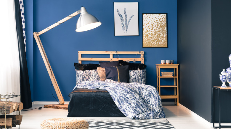 blue walls with black bedding