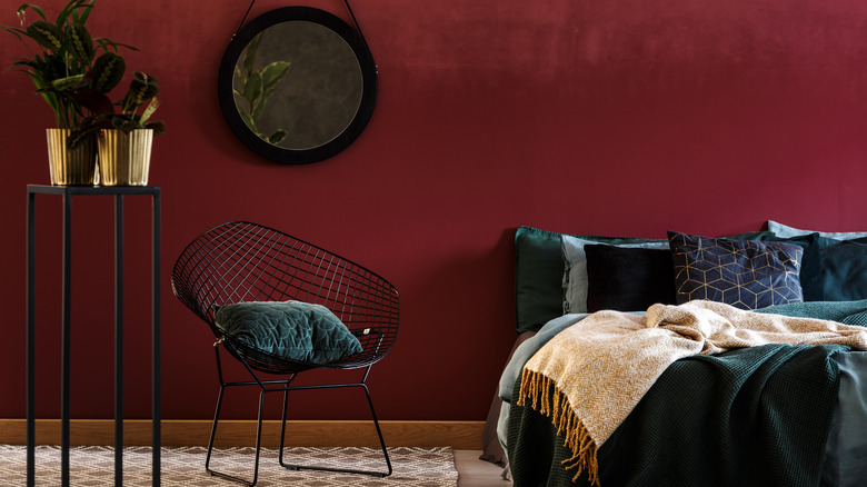 red wall with black bedding