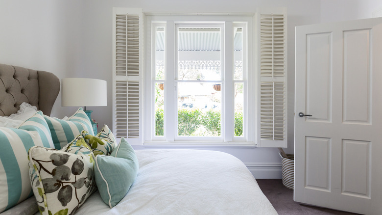 Bedroom with window shutters