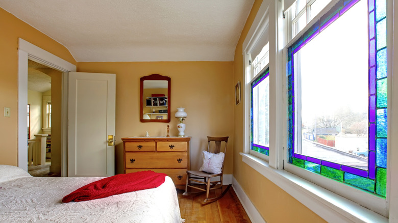 Bedroom with stained glass window