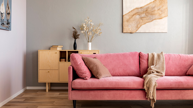 Gray walls with rose couch