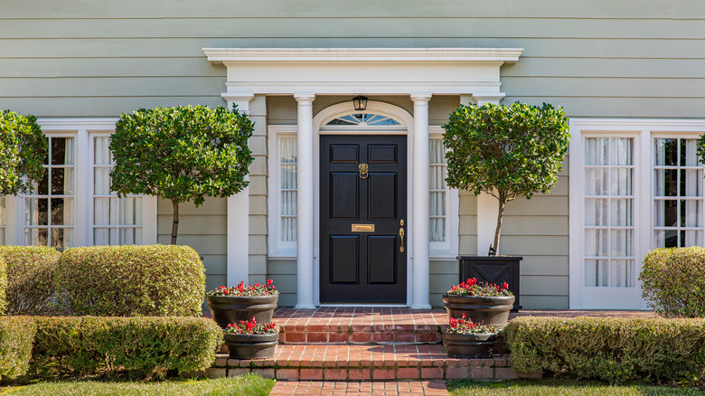 Black door with brick steps