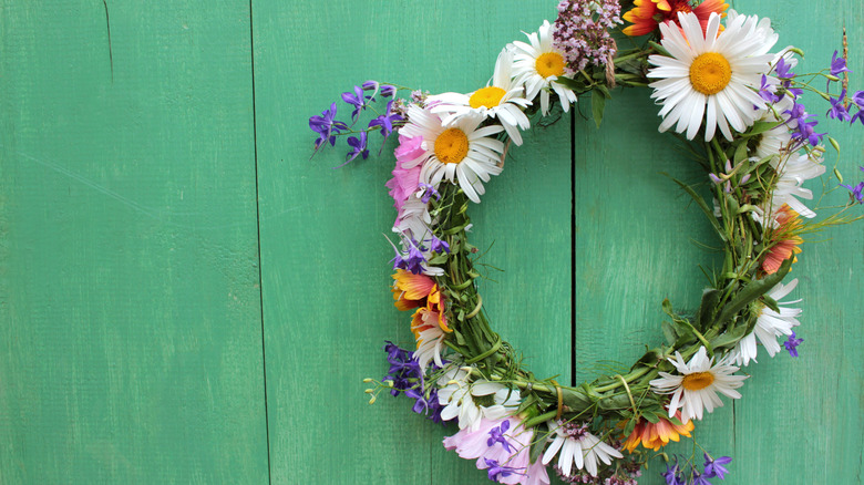 Green door with wreath