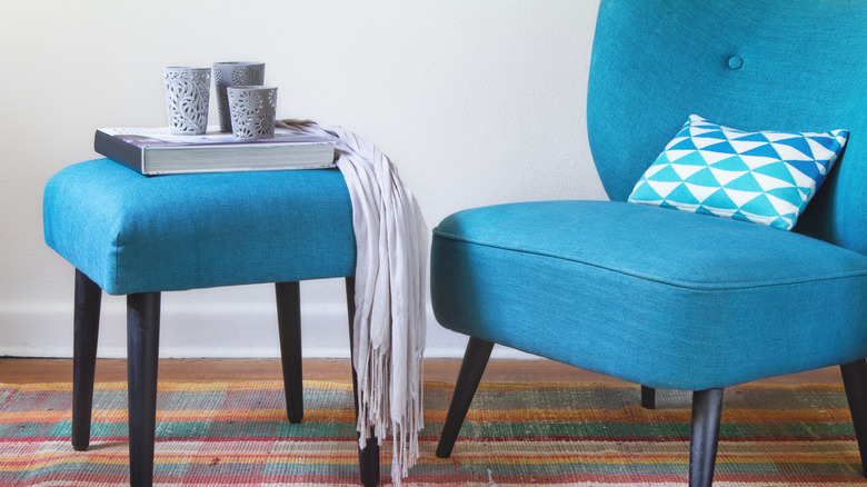 teal chair with footrest