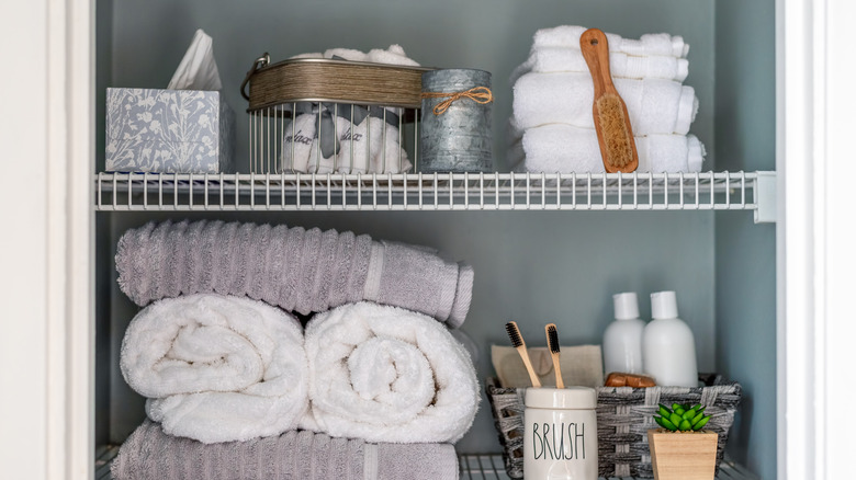 organized bathroom linen closet 