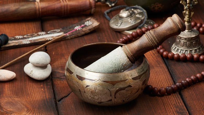 Tibetan singing bowl and artifacts