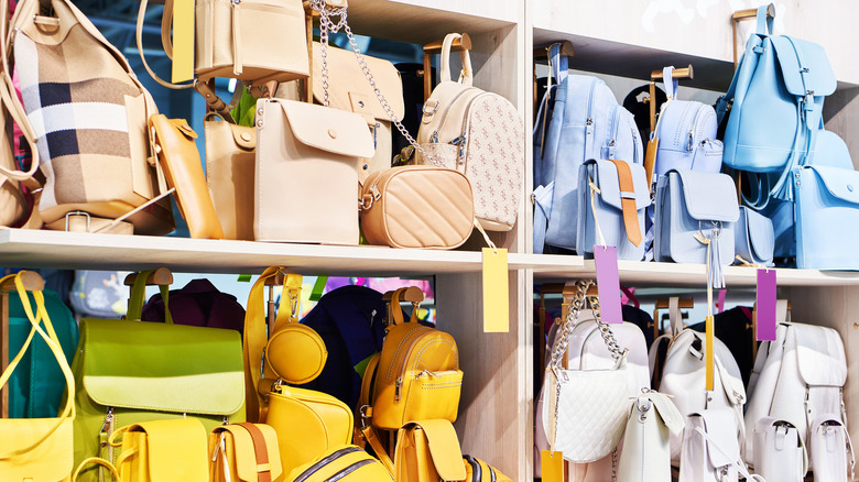 Purses on a bookshelf