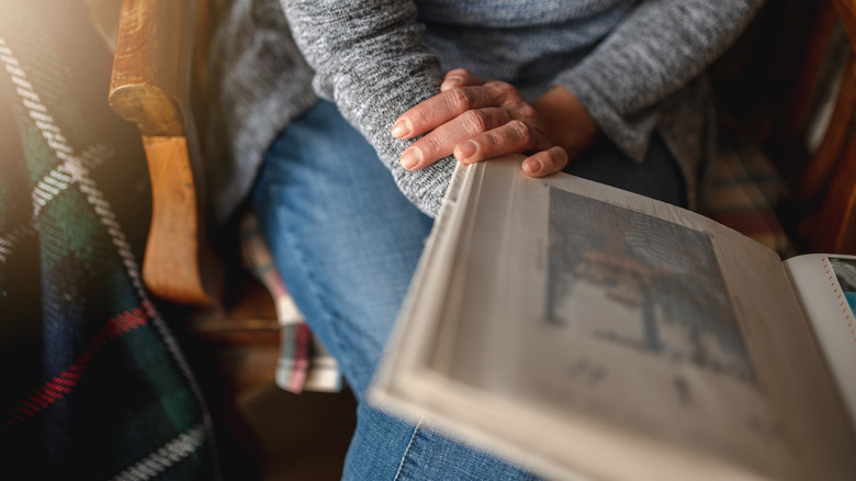 Person holding photo album