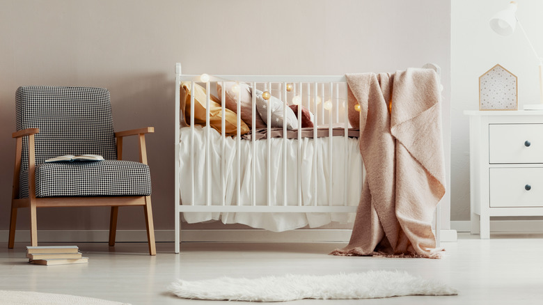 beige nursery with white crib