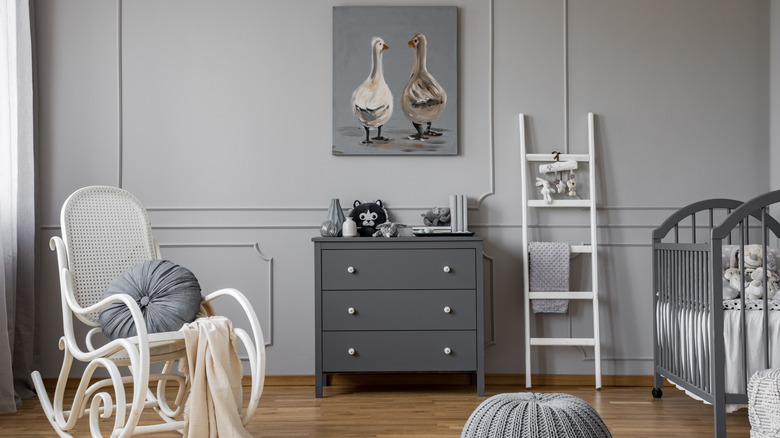 Light gray nursery with chair