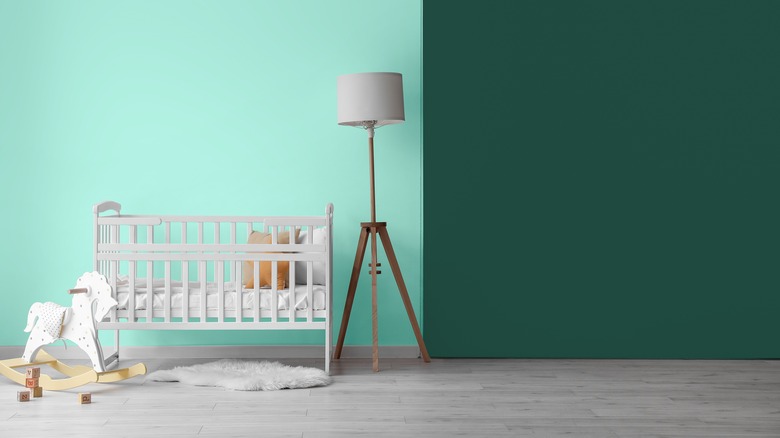 wall with crib and lamp