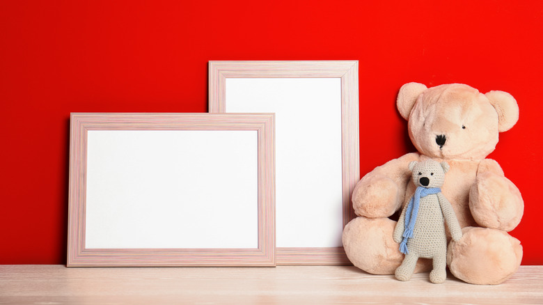 red wall with teddy bears