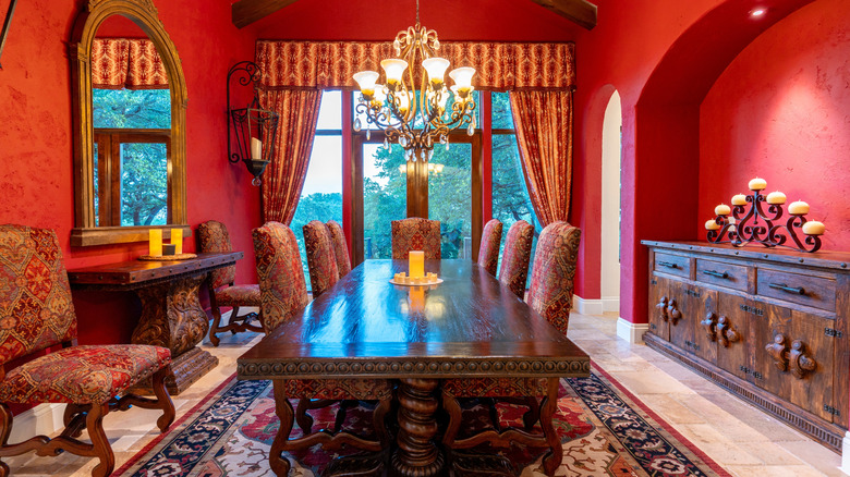 Formal dining room with red walls