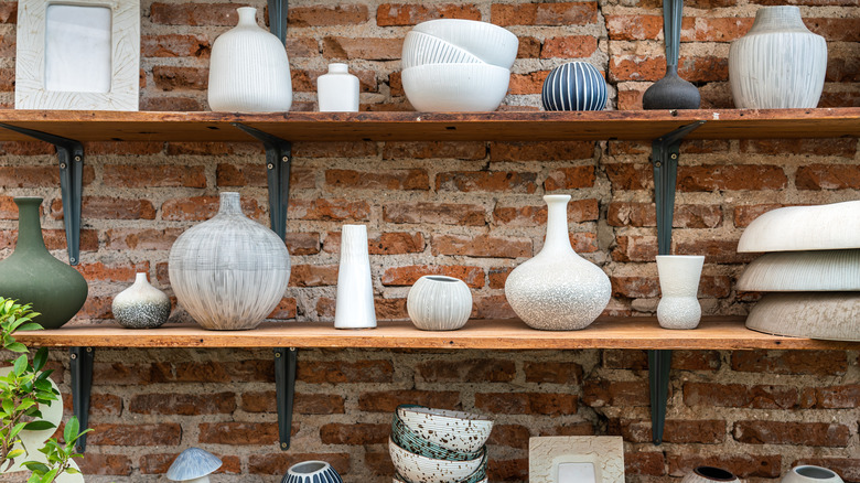 shelves filled with ceramic objects