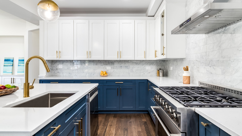 Blue kitchen island and cabinets